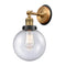 Beacon Sconce shown in the Brushed Brass finish with a Seedy shade