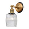 Colton Sconce shown in the Brushed Brass finish with a Clear Halophane shade