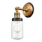 Dover Sconce shown in the Brushed Brass finish with a Clear shade