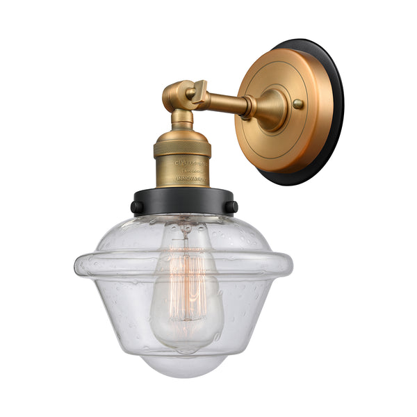 Oxford Sconce shown in the Brushed Brass finish with a Seedy shade