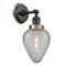 Geneseo Sconce shown in the Matte Black finish with a Clear Crackled shade