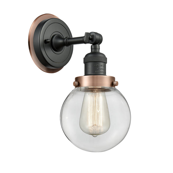 Beacon Sconce shown in the Matte Black finish with a Clear shade