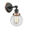 Beacon Sconce shown in the Matte Black finish with a Clear shade