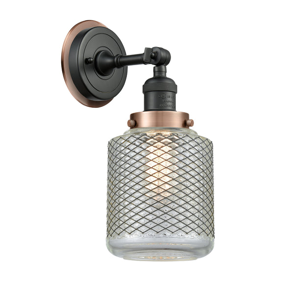 Stanton Sconce shown in the Matte Black finish with a Clear Wire Mesh shade
