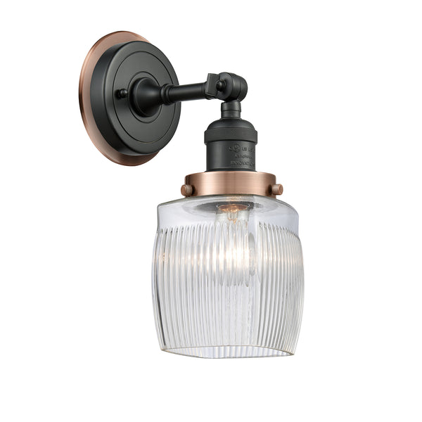 Colton Sconce shown in the Matte Black finish with a Clear Halophane shade