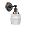 Colton Sconce shown in the Matte Black finish with a Clear Halophane shade
