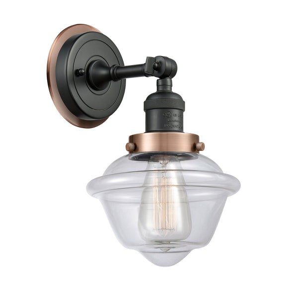 Oxford Sconce shown in the Matte Black finish with a Clear shade