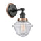Oxford Sconce shown in the Matte Black finish with a Seedy shade