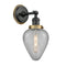 Geneseo Sconce shown in the Matte Black finish with a Clear Crackled shade