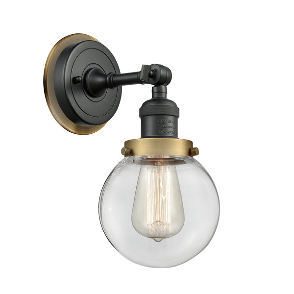 Beacon Sconce shown in the Matte Black finish with a Clear shade