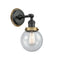 Beacon Sconce shown in the Matte Black finish with a Seedy shade
