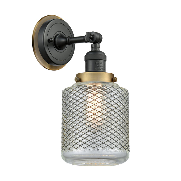 Stanton Sconce shown in the Matte Black finish with a Clear Wire Mesh shade