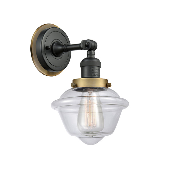 Oxford Sconce shown in the Matte Black finish with a Clear shade