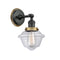 Oxford Sconce shown in the Matte Black finish with a Clear shade