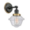 Oxford Sconce shown in the Matte Black finish with a Seedy shade