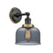 Bell Sconce shown in the Matte Black finish with a Plated Smoke shade