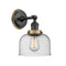Bell Sconce shown in the Matte Black finish with a Seedy shade