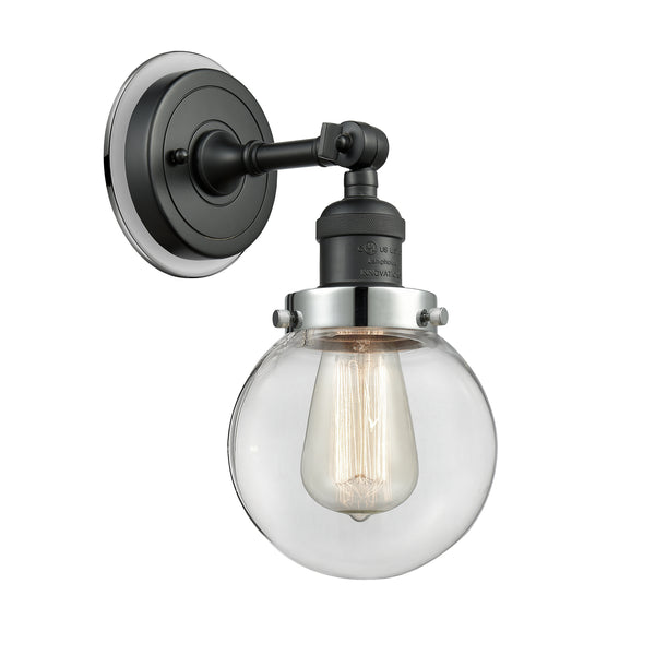 Beacon Sconce shown in the Matte Black finish with a Clear shade