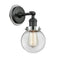 Beacon Sconce shown in the Matte Black finish with a Clear shade