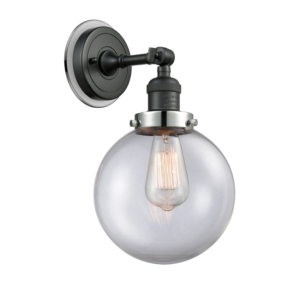 Beacon Sconce shown in the Matte Black finish with a Clear shade