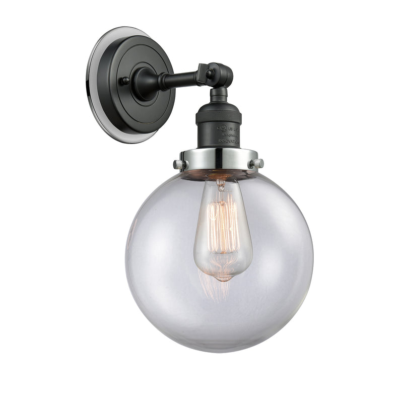Beacon Sconce shown in the Matte Black finish with a Clear shade