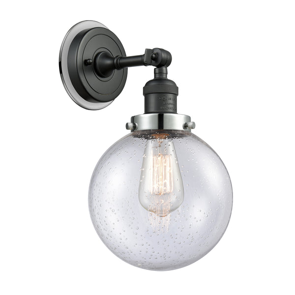 Beacon Sconce shown in the Matte Black finish with a Seedy shade