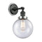 Beacon Sconce shown in the Matte Black finish with a Seedy shade
