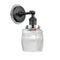 Colton Sconce shown in the Matte Black finish with a Clear Halophane shade