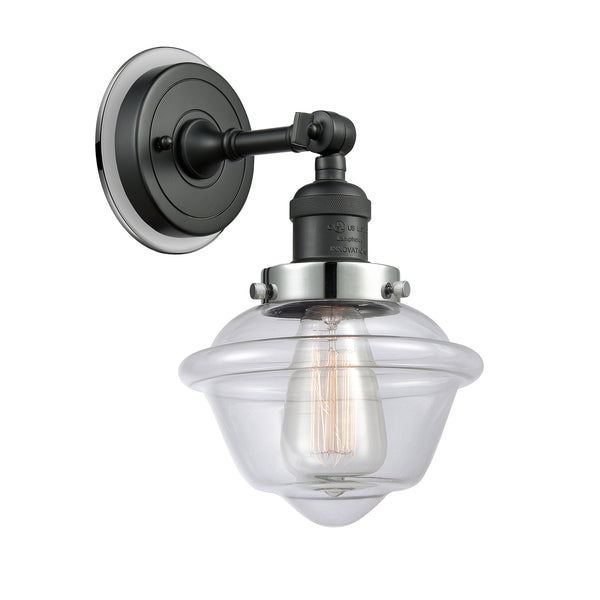 Oxford Sconce shown in the Matte Black finish with a Clear shade