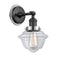 Oxford Sconce shown in the Matte Black finish with a Clear shade