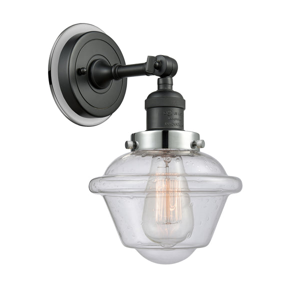 Oxford Sconce shown in the Matte Black finish with a Seedy shade