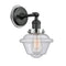 Oxford Sconce shown in the Matte Black finish with a Seedy shade