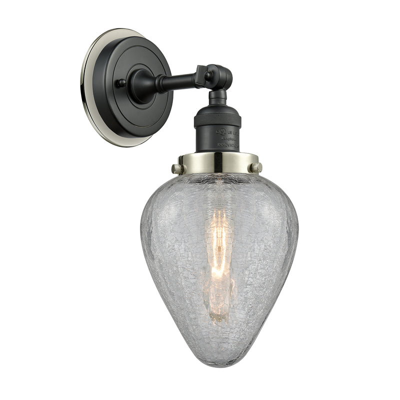 Geneseo Sconce shown in the Matte Black finish with a Clear Crackled shade