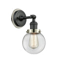 Beacon Sconce shown in the Matte Black finish with a Clear shade