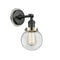 Beacon Sconce shown in the Matte Black finish with a Clear shade