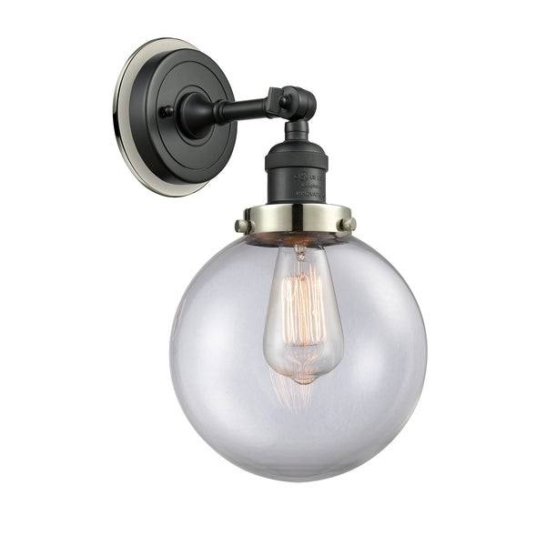 Beacon Sconce shown in the Matte Black finish with a Clear shade