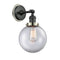Beacon Sconce shown in the Matte Black finish with a Clear shade