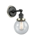 Beacon Sconce shown in the Matte Black finish with a Seedy shade