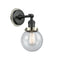 Beacon Sconce shown in the Matte Black finish with a Seedy shade