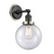 Beacon Sconce shown in the Matte Black finish with a Seedy shade