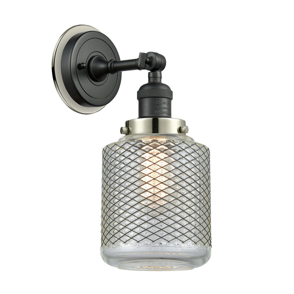 Stanton Sconce shown in the Matte Black finish with a Clear Wire Mesh shade