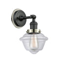 Oxford Sconce shown in the Matte Black finish with a Clear shade