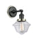 Oxford Sconce shown in the Matte Black finish with a Clear shade