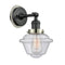 Oxford Sconce shown in the Matte Black finish with a Seedy shade