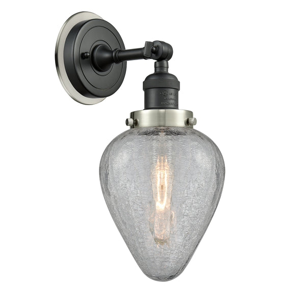 Geneseo Sconce shown in the Matte Black finish with a Clear Crackled shade