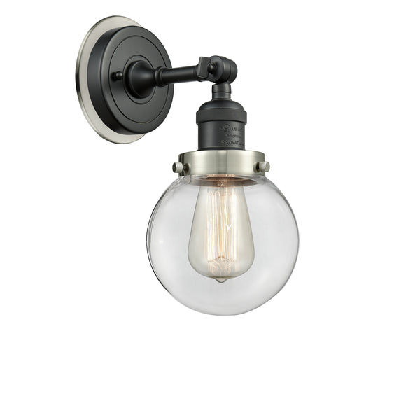 Beacon Sconce shown in the Matte Black finish with a Clear shade