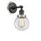 Beacon Sconce shown in the Matte Black finish with a Clear shade