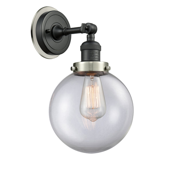 Beacon Sconce shown in the Matte Black finish with a Clear shade