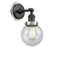 Beacon Sconce shown in the Matte Black finish with a Seedy shade