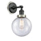Beacon Sconce shown in the Matte Black finish with a Seedy shade